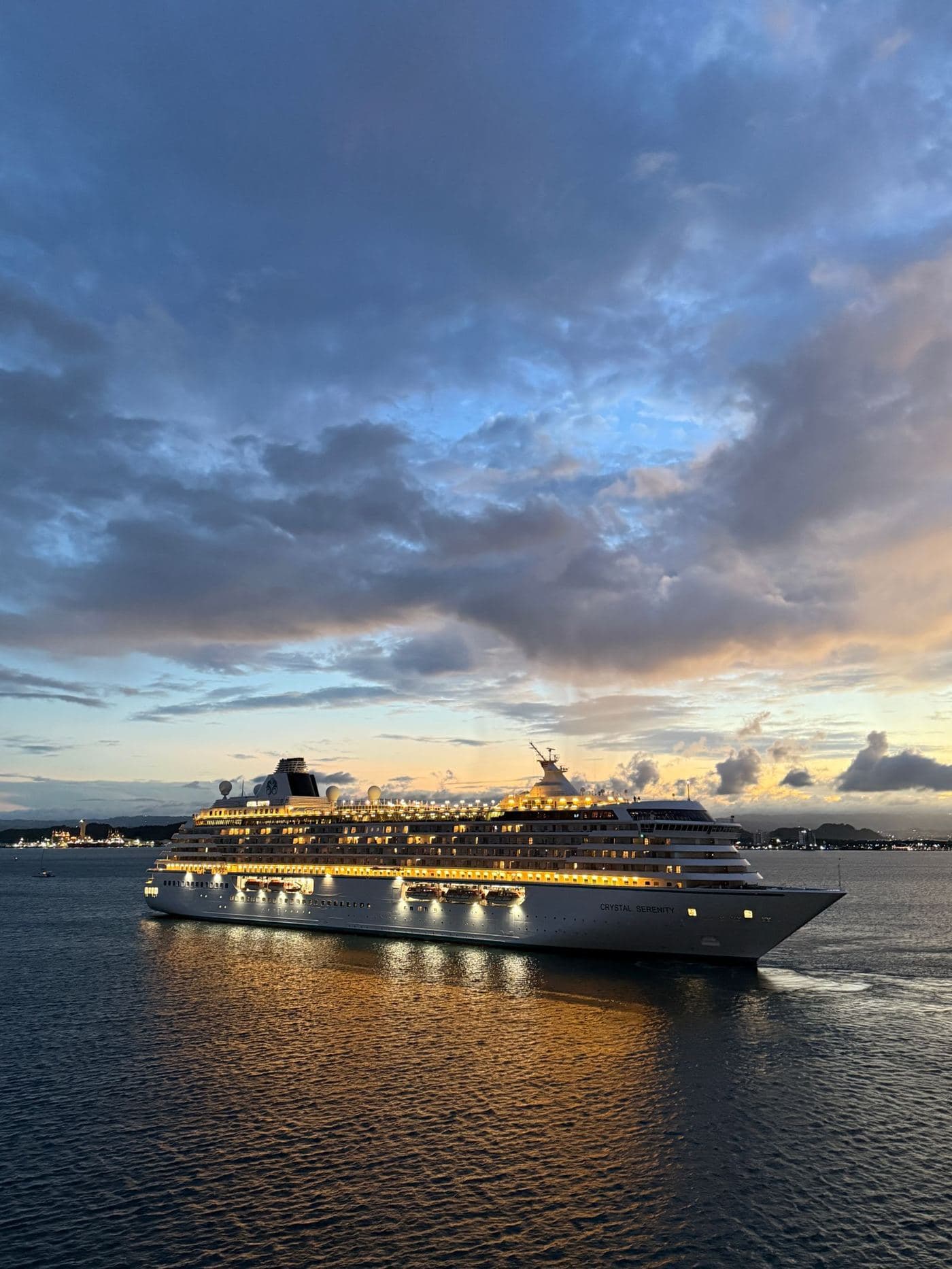 A cruise ship lit up at dusk